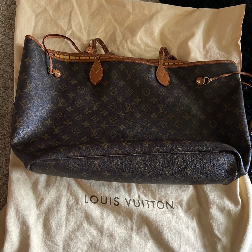 Louis Vuitton never full yellow interior, used.